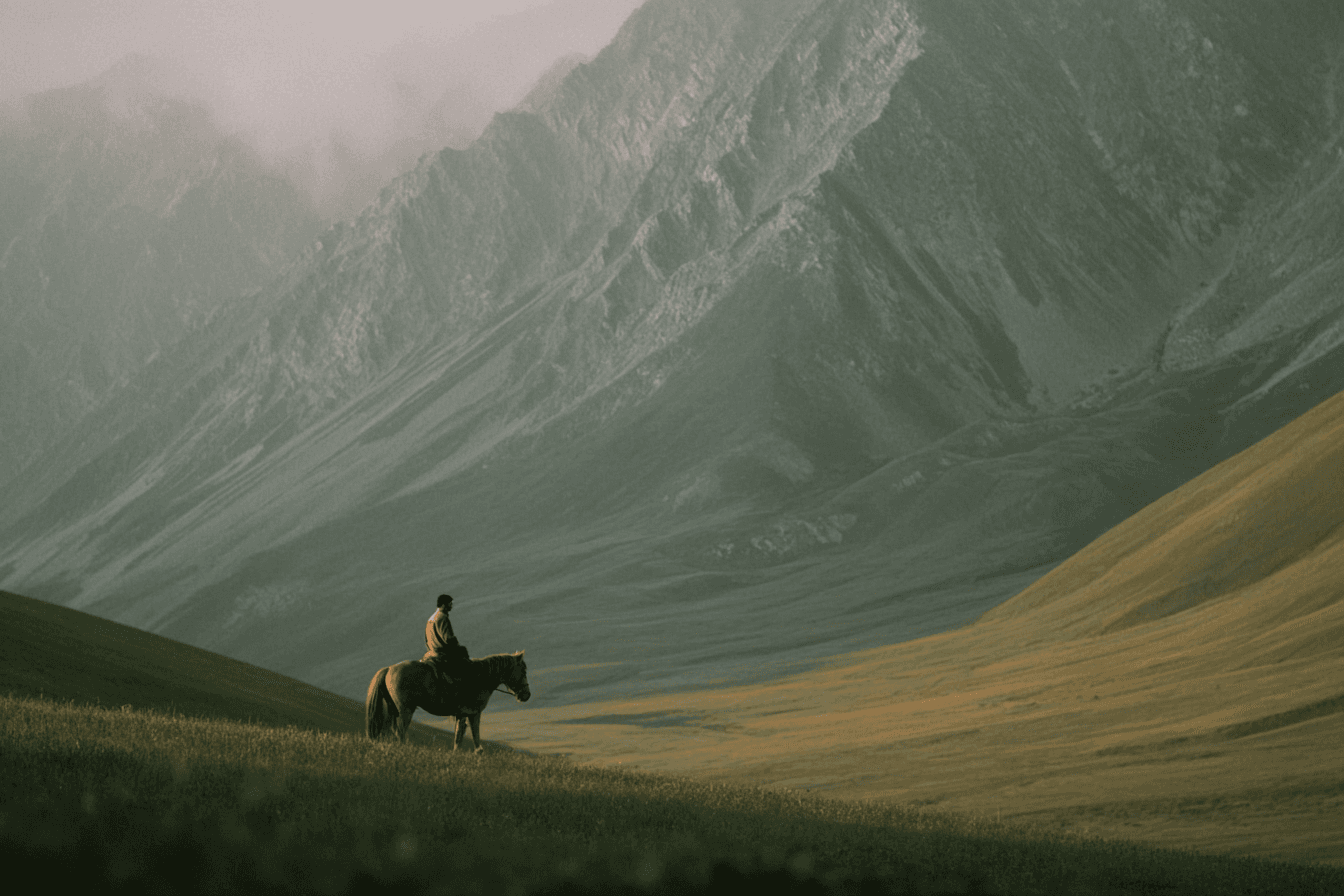 Editorial placeholder from the original template: a rider in a mountain landscape